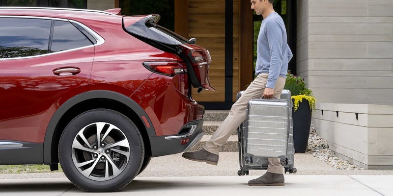 Man Opening Trunk of Traverse