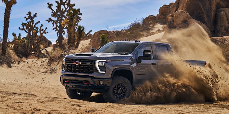Photo of Chevrolet Silverado Driving Through Dirt