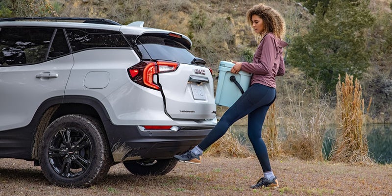 Woman Loading GMC Terrain with Cooler