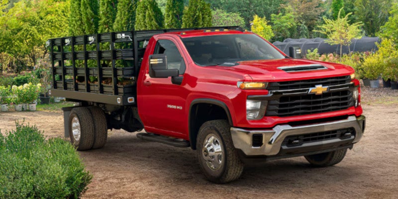Silverado 3500 Chassis in Red Parked On A Dirt Road
